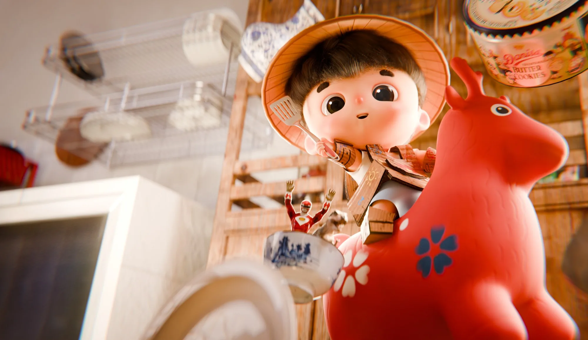 A boy in a conical hat rides a red toy deer through a kitchen, spatula raised, beside a butter cookie tin.