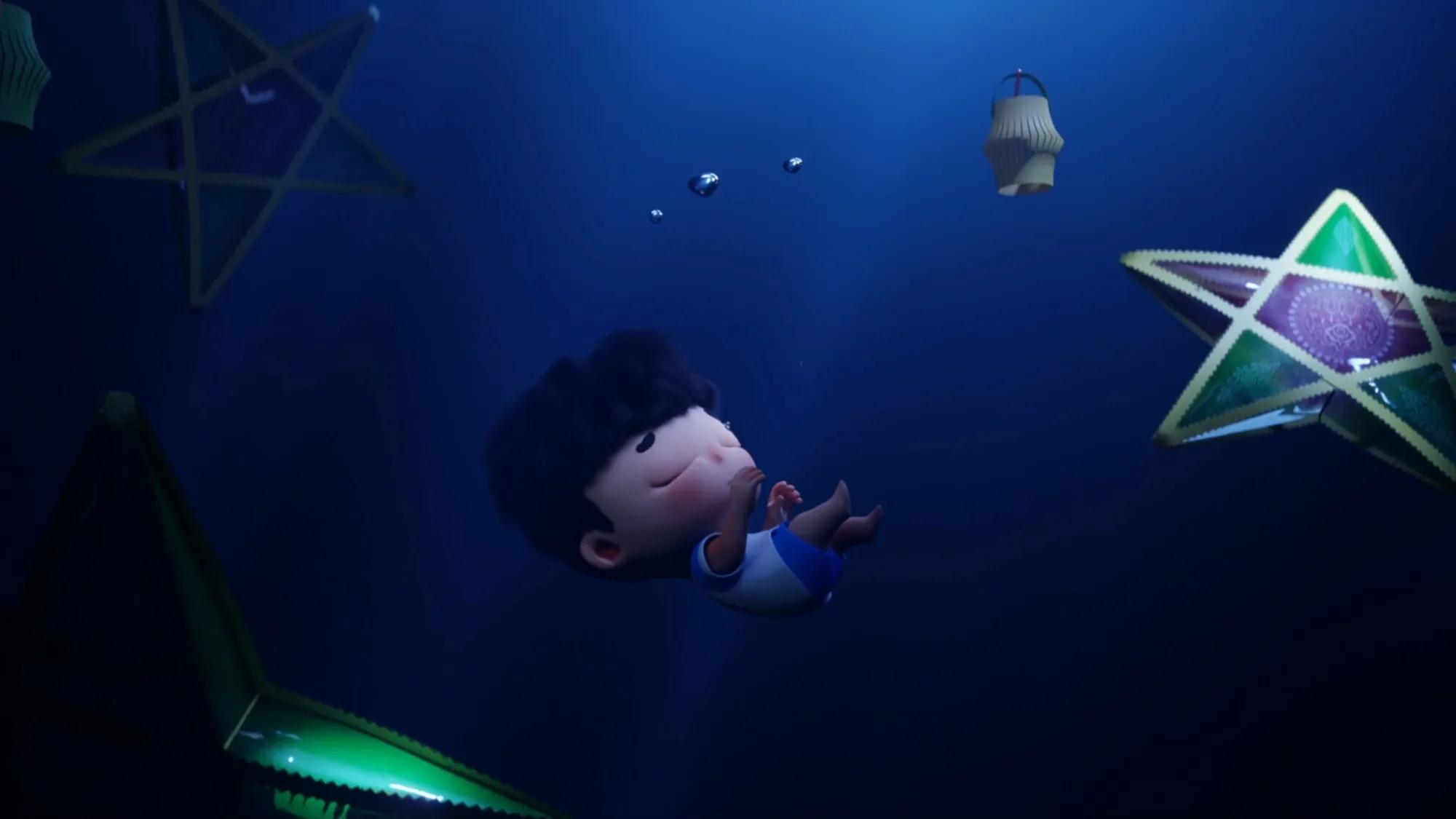 A boy drifts underwater, eyes closed, among glowing star lanterns.